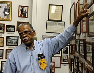 A man in Sky Blue shirt wearing glasses