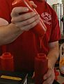 2008-11-12 Russell pouring ketchup at Elmo's Diner