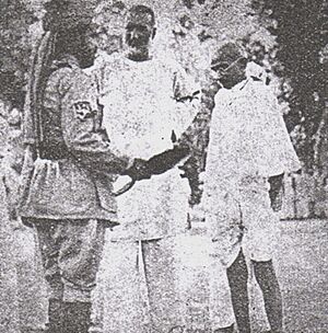 Gandhi, Ghaffar Khan with a Khaksar leader