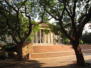 Great Hall facade through jacarandas