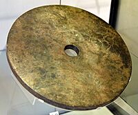 Jade disc (Bi). Nephrite jade. Liangzhu Culture, south-east China. Neolithic period, c. 2500 BCE. Victoria and Albert Museum, London