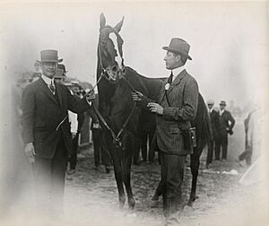 Regret with trainer James Rowe and owner Harry Payne Whitney, 1915