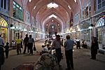 Covered arcade lined by shops.