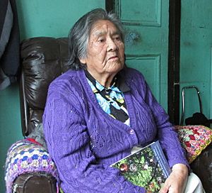 A photo of Cristina Calderón in 2013, sitting in a chair