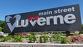 Sign saying main street LUVERNE. The V in Luverne is a heart and which is repeated before the word.