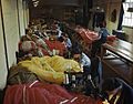 Members of the Womens Auxiliary Air Force (WAAF) repair and pack parachutes for use by airborne troops during the Normandy invasion, 31 May 1944. TR1783