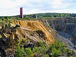 Open pit mine and mining infrastructure in the background