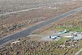 U.S. Marine Corps HC-130 Hercules aircraft assigned to the 3rd Marine Expeditionary Brigade and other military aircraft sit on the tarmac at an airport in Guiuan, Philippines, waiting to airlift Philippine 131117-N-XN177-381