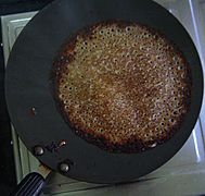 Methi dosa on a pan