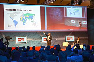 2014-03-14 CeBIT Global Conferences, Jimmy Wales, Founder Wikipedia, (26) On stage showing the world for Wikipedia Zero (500 millions), while Brent Goff is still listening