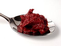 Tomato paste on spoon