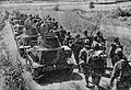 Japanese tankettes with pioneer troops marching towards Wu-han, near Na-hsi