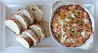 Warm crab and lobster dip served with bread