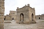 Fire temple in stone, surrounded by walls