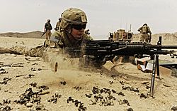 Airman firing Mk 48 on bipod near FOB Mehtar Lam