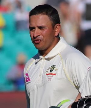 A head and shoulders photograph of a man in cricket whites