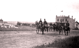 Police parade before Fort mainstreat shop