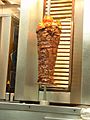 Vertically rotating roasted lamb