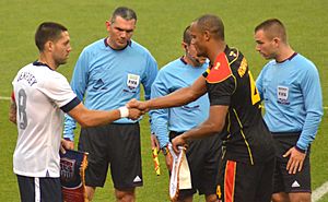 Clint Dempsey and Vincent Kompany exchange pennants USA vs Belgium