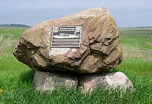 Simple rock cairn with bronze plaque