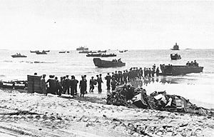 Troops unloading supplies at Aitape.jpg