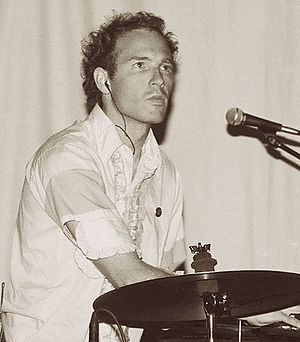 Snaith behind a cymbal and microphone