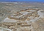 Ruins of buildings in a desert.