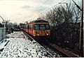 Class 303 016 at Langside