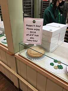 Happy Pi Day sign for sales on pies at Delicious Orchards