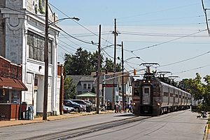 A South Shore Line train stops at 11th Street station.