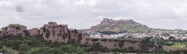 Golconda, fortress wall in foreground and fort at a distance